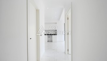 Привлекательная квартира 1+1 в современном комплексе в районе Махмутлар по выгодной цене. - Ракурс 3