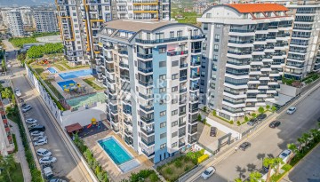 Современная квартира 1+1 в новом доме 2023 года в Махмутларе в 550 метрах от моря - Ракурс 1