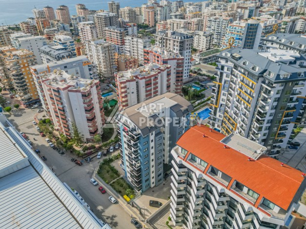 Современная квартира 1+1 в новом доме 2023 года в Махмутларе в 550 метрах от моря - Ракурс 25