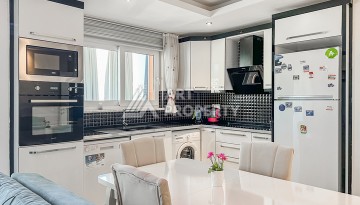 Квартира 1+1 с боковым видом на море в Махмутларе в 600 метрах от пляжа - Ракурс 12