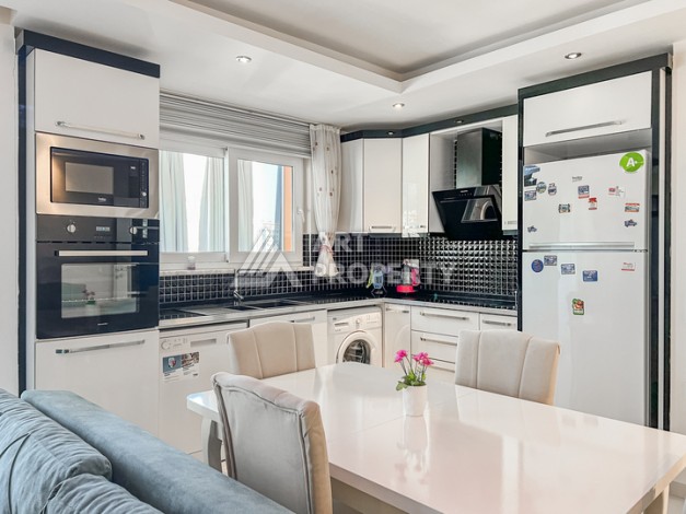 Квартира 1+1 с боковым видом на море в Махмутларе в 600 метрах от пляжа - Ракурс 11