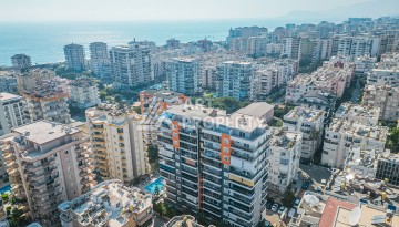 Квартира 1+1 с боковым видом на море в Махмутларе в 600 метрах от пляжа - Ракурс 19