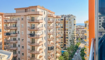 Квартира 1+1 с боковым видом на море в Махмутларе в 600 метрах от пляжа - Ракурс 20