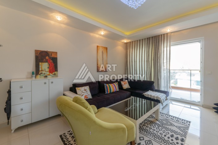 Просторная квартира 1+1 в Махмутларе в 200 метрах от моря с панорамными видами - Ракурс 2