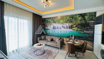 Уютная квартира 1+1 в центре Махмутлара — отличный вариант для жизни и отдыха у моря. - Ракурс 1