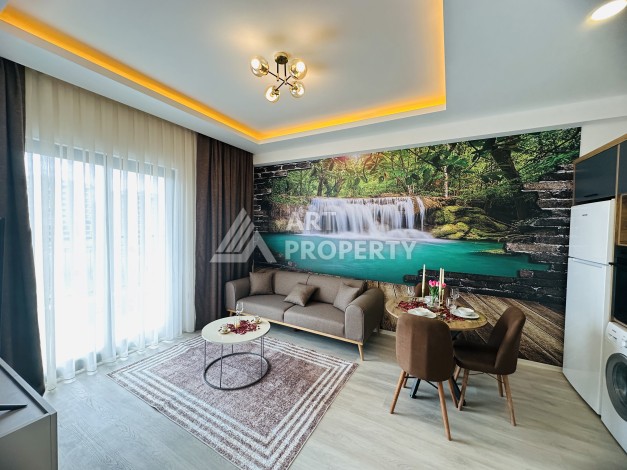 Уютная квартира 1+1 в центре Махмутлара — отличный вариант для жизни и отдыха у моря. - Ракурс 0