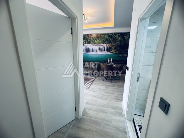 Уютная квартира 1+1 в центре Махмутлара — отличный вариант для жизни и отдыха у моря. - Ракурс 2