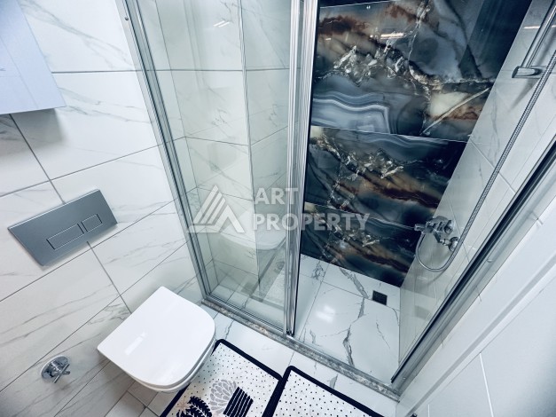 Уютная квартира 1+1 в центре Махмутлара — отличный вариант для жизни и отдыха у моря. - Ракурс 3