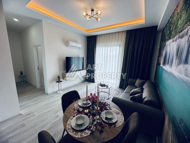 Уютная квартира 1+1 в центре Махмутлара — отличный вариант для жизни и отдыха у моря. - Ракурс 5