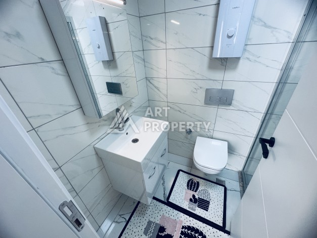 Уютная квартира 1+1 в центре Махмутлара — отличный вариант для жизни и отдыха у моря. - Ракурс 6