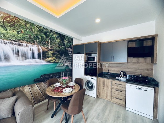 Уютная квартира 1+1 в центре Махмутлара — отличный вариант для жизни и отдыха у моря. - Ракурс 7