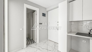 Квартира 1+1 в современном комплексе района Махмутлар - Ракурс 7