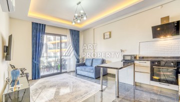 Современная квартира планировки 1+1 с мебелью и техникой в комплексе с богатой инфраструктурой в районе в Махмутларе. - Ракурс 4