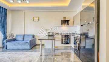 Современная квартира планировки 1+1 с мебелью и техникой в комплексе с богатой инфраструктурой в районе в Махмутларе. - Ракурс 5