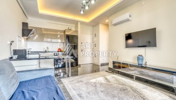 Современная квартира планировки 1+1 с мебелью и техникой в комплексе с богатой инфраструктурой в районе в Махмутларе. - Ракурс 9