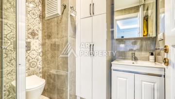 Современная квартира планировки 1+1 с мебелью и техникой в комплексе с богатой инфраструктурой в районе в Махмутларе. - Ракурс 10