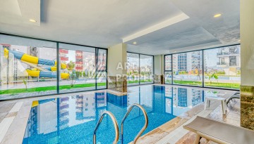 Современная квартира планировки 1+1 с мебелью и техникой в комплексе с богатой инфраструктурой в районе в Махмутларе. - Ракурс 12