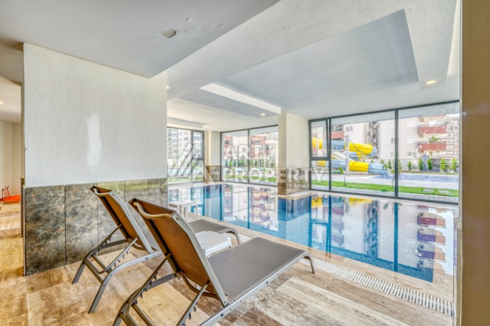 Современная квартира планировки 1+1 с мебелью и техникой в комплексе с богатой инфраструктурой в районе в Махмутларе. - Ракурс 12