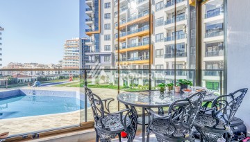 Современная квартира планировки 1+1 с мебелью и техникой в комплексе с богатой инфраструктурой в районе в Махмутларе. - Ракурс 14