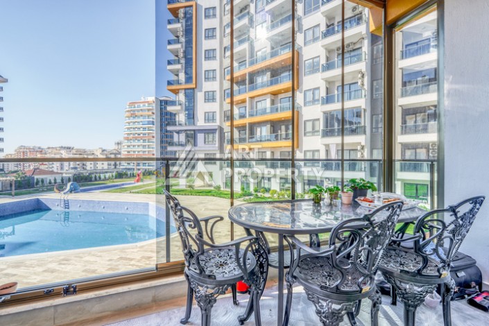 Современная квартира планировки 1+1 с мебелью и техникой в комплексе с богатой инфраструктурой в районе в Махмутларе. - Ракурс 13