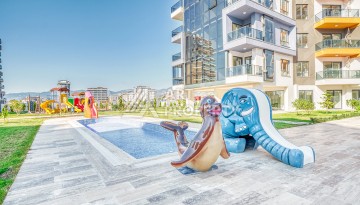 Современная квартира планировки 1+1 с мебелью и техникой в комплексе с богатой инфраструктурой в районе в Махмутларе. - Ракурс 15