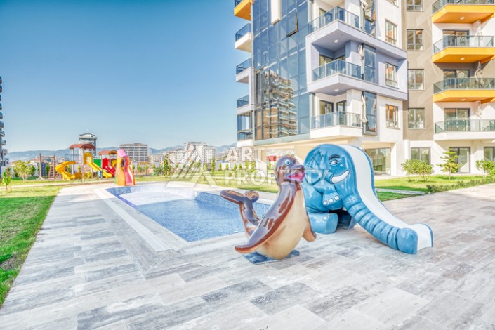 Современная квартира планировки 1+1 с мебелью и техникой в комплексе с богатой инфраструктурой в районе в Махмутларе. - Ракурс 14