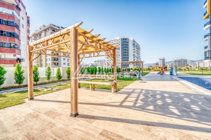 Современная квартира планировки 1+1 с мебелью и техникой в комплексе с богатой инфраструктурой в районе в Махмутларе. - Ракурс 15