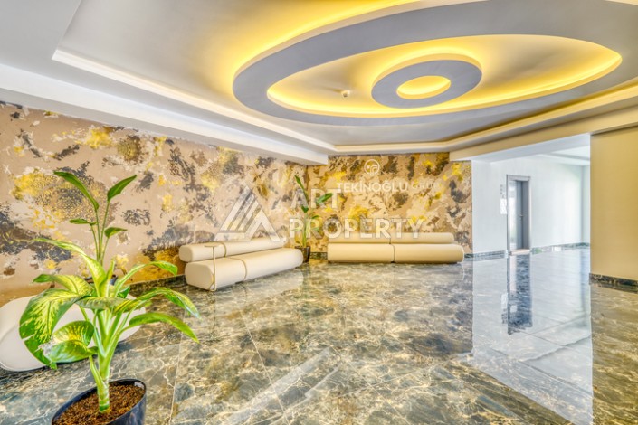 Современная квартира планировки 1+1 с мебелью и техникой в комплексе с богатой инфраструктурой в районе в Махмутларе. - Ракурс 18