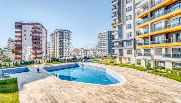 Современная квартира планировки 1+1 с мебелью и техникой в комплексе с богатой инфраструктурой в районе в Махмутларе. - Ракурс 20