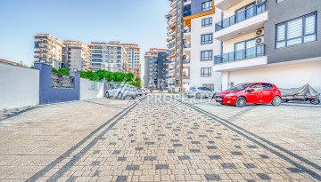 Современная квартира планировки 1+1 с мебелью и техникой в комплексе с богатой инфраструктурой в районе в Махмутларе. - Ракурс 21