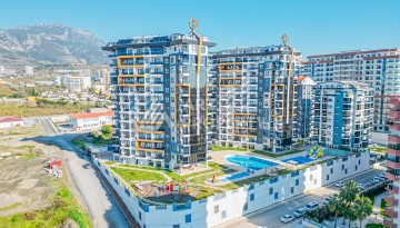 Современная квартира планировки 1+1 с мебелью и техникой в комплексе с богатой инфраструктурой в районе в Махмутларе. - Ракурс 22