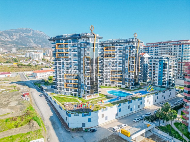 Современная квартира планировки 1+1 с мебелью и техникой в комплексе с богатой инфраструктурой в районе в Махмутларе. - Ракурс 21