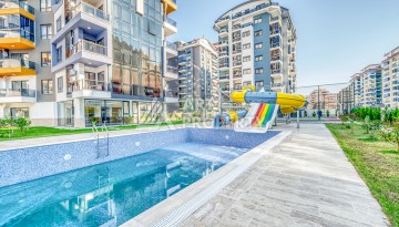 Современная квартира планировки 1+1 с мебелью и техникой в комплексе с богатой инфраструктурой в районе в Махмутларе. - Ракурс 23