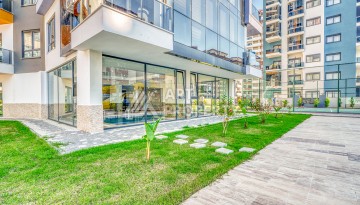 Современная квартира планировки 1+1 с мебелью и техникой в комплексе с богатой инфраструктурой в районе в Махмутларе. - Ракурс 24