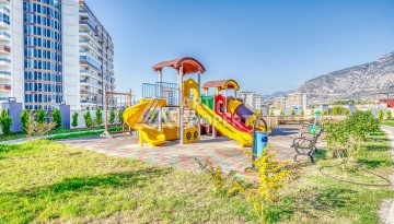 Современная квартира планировки 1+1 с мебелью и техникой в комплексе с богатой инфраструктурой в районе в Махмутларе. - Ракурс 26