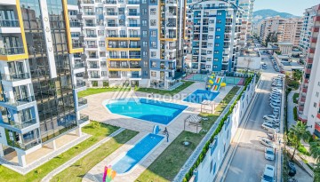 Современная квартира планировки 1+1 с мебелью и техникой в комплексе с богатой инфраструктурой в районе в Махмутларе. - Ракурс 27