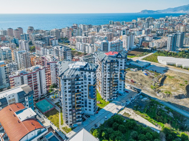 Современная квартира планировки 1+1 с мебелью и техникой в комплексе с богатой инфраструктурой в районе в Махмутларе. - Ракурс 27