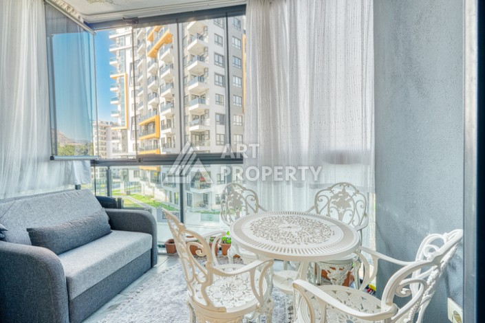 Современная квартира 1+1 в новом комплексе в районе Махмутлар — стильное решение для жизни у моря. - Ракурс 6