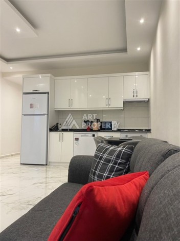 Уютная меблированная квартира 1+1 в центре Алании — идеальный вариант для жизни и инвестиций у моря - Ракурс 1