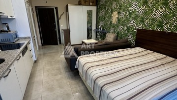 Квартира-студия в центре Махмутлара, рези денция отельного типа, море в 500 метрах - Ракурс 12