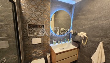 Просторный меблированный дуплекс 2+1 с панорамными видами на горы и город в  районе Каргыджак. - Ракурс 32