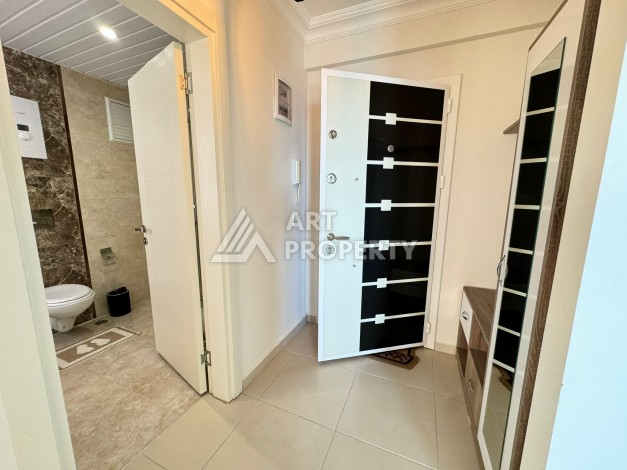 Квартира 1+1 с видом на море в Махмутларе, 70 кв.м. - Ракурс 27