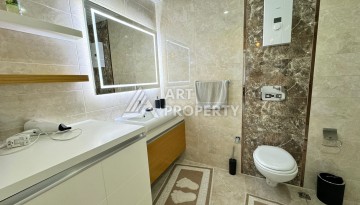 Квартира 1+1 с видом на море в Махмутларе, 70 кв.м. - Ракурс 32