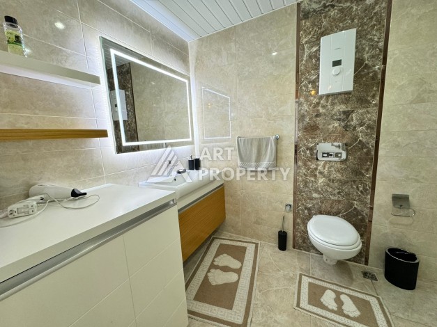 Квартира 1+1 с видом на море в Махмутларе, 70 кв.м. - Ракурс 31