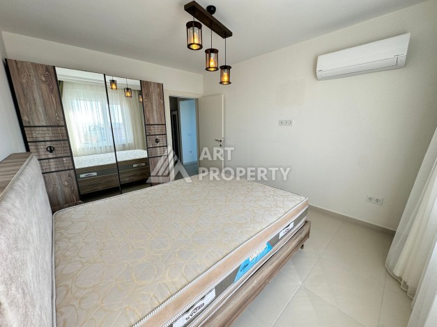 Квартира 1+1 с видом на море в Махмутларе, 70 кв.м. - Ракурс 32