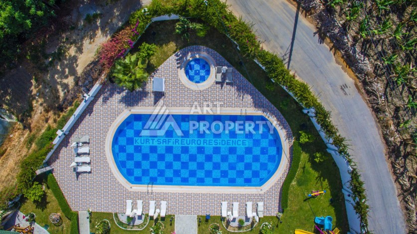 Квартира 1+1 с видом на море в Махмутларе, 70 кв.м. - Ракурс 37