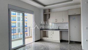 Уютная квартира 1+1 в Махмутларе, 55 м², 3 этаж, комплекс с бассейном - Ракурс 1
