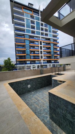 Уютная квартира 1+1 в Махмутларе, 55 м², 3 этаж, комплекс с бассейном - Ракурс 6