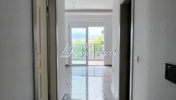 Уютная квартира 1+1 в Махмутларе, 55 м², 3 этаж, комплекс с бассейном - Ракурс 8