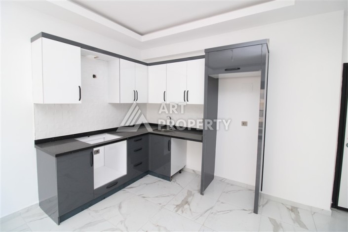 Новая квартира 1+1 в современном доме в районе Махмутлар — 500 м до моря. - Ракурс 1